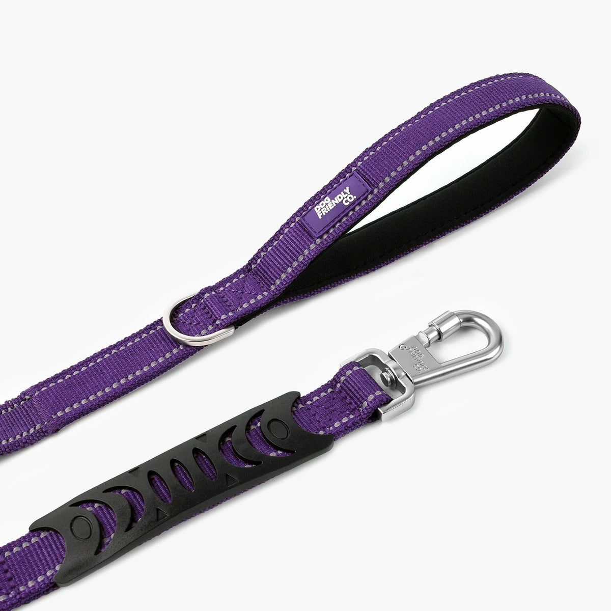 Close-up of the padded handle, clip and bungee grip of the Indigo bungee leash