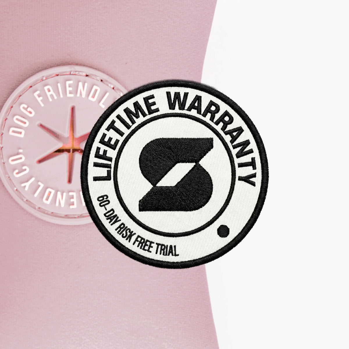 Lifetime Warranty, 60-day risk free trial badge over the Sakura poop bag holder