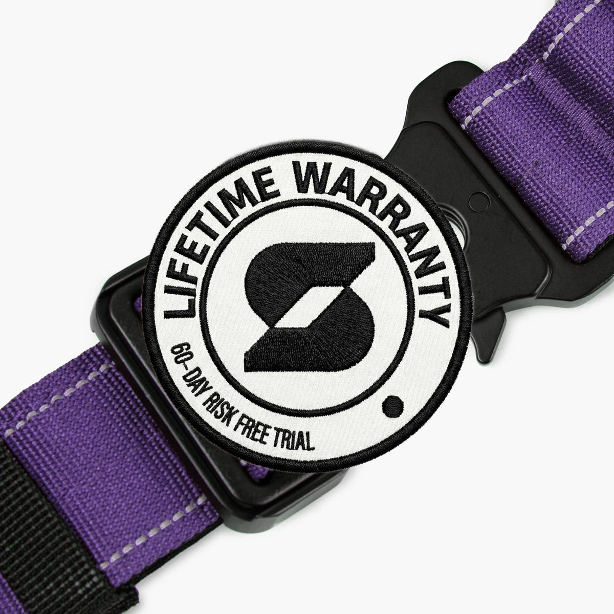 Lifetime Warranty, 60-day risk free trial badge over the Indigo tactical collar buckle